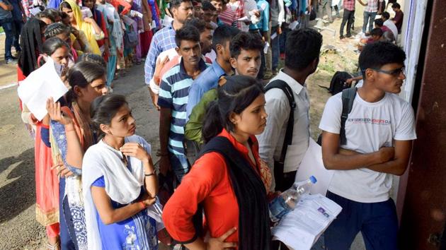Applicants for Uttar Pradesh Police Constable Recruitment wait in a queue outside their exam centre in Allahabad. The Uttar Pradesh STF has arrested at least 16 people in connection with cheating in the state police constable recruitment examination, an official said. The two-day examination, which began on Monday, is being conducted at 860 centres in 56 districts to fill 41,520 posts. (PTI) Applicants for Uttar Pradesh Police Constable Recruitment wait in a queue outside their exam centre in Allahabad. The Uttar Pradesh STF has arrested at least 16 people in connection with cheating in the state police constable recruitment examination, an official said. The two-day examination, which began on Monday, is being conducted at 860 centres in 56 districts to fill 41,520 posts. (PTI)