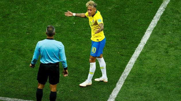 Brazil's Neymar talks with a referee. He was the target of many a fouls by Swiss players. (REUTERS)
