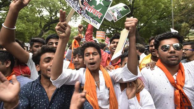 Bajrang Dal activists shout slogans during a recent protest in New Delhi on Wednesday. About four days ago, the Central Intelligence Agency had named the Bajrang Dal as a ‘religious militant organisation’ in its World Factbook.(Ravi Choudhary/HT PHOTO)