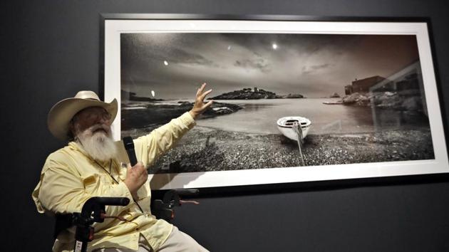 Clyde Butcher gestures as he gives a description of one of his photographs during the opening of his Clyde Butcher, Visions of Dali's Spain exhibit. (AP) Clyde Butcher gestures as he gives a description of one of his photographs during the opening of his Clyde Butcher, Visions of Dali's Spain exhibit. (AP)