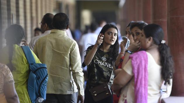 The Delhi university announced its first list on Monday with 98.75% for BA Programme at Lady Shri Ram (LSR) College being the highest cutoff. Students will have until Thursday to get their documents verified and have their admissions confirmed at colleges where they have cleared the cutoff percentages under the first merit list. (Sanchit Khanna / HT Photo)