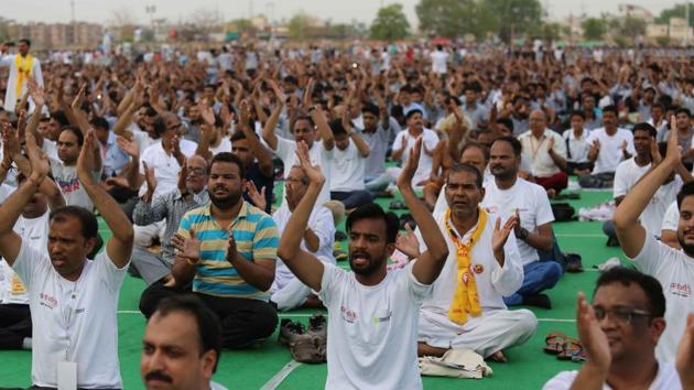 Participants at the three-day yoga camp being conducted by Baba Ramdev in Kota on Tuesday.(AH Zaidi/HT Photo)