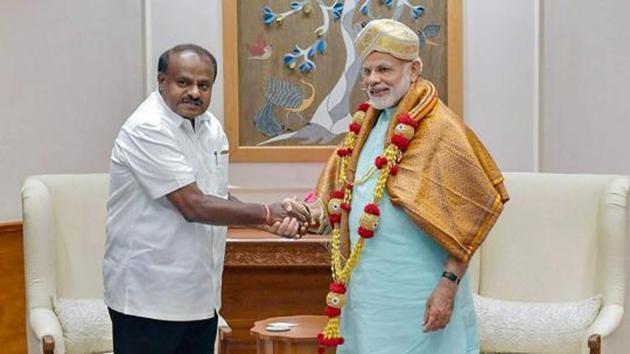 Karnataka chief minister HD Kumaraswamy meets Prime Minister Narendra Modi, in New Delhi, May 28(PTI)