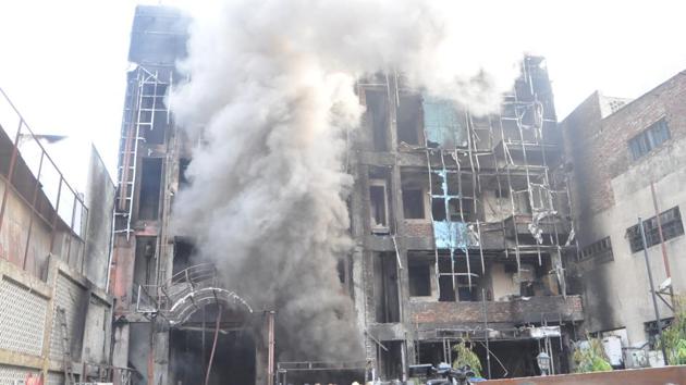 Five people, including a one-year-old child were killed and six others injured after a fire broke out in two hotels in the crowded Naka area of Uttar Pradesh’s Lucknow on Tuesday morning. At least 38 guests were rescued by firefighters from the hotels which were completely damaged in the fire. (Deepak Gupta / HT Photo)