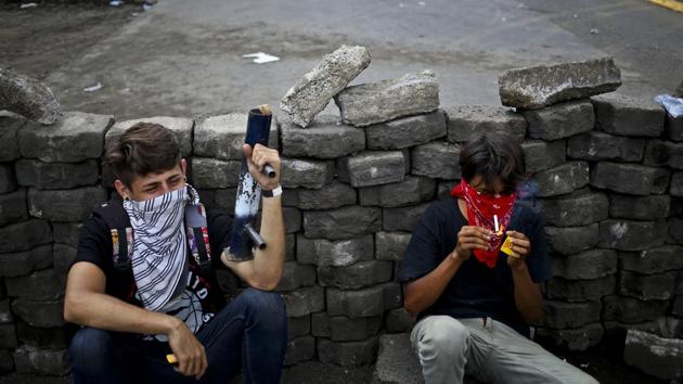 Echoing another tactic of the revolution, whole segments of cobblestone streets have been pried up, especially in Masaya, southeast of the capital. The stones are stacked into waist-high barricades, just as the Sandinistas did to fend of Anastasio Somoza’s security forces. (Esteban Felix / AP)