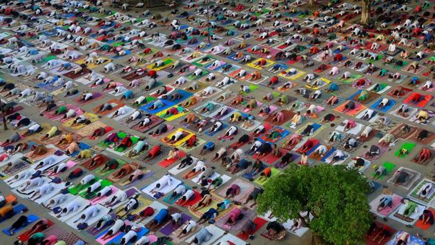 People perform yoga during a practice session ahead of International Yoga Day, in Chandigarh. Uttarakhand’s forest department has started an intensive drive to look for snakes and monkeys in the sprawling Forest Research Institute (FRI) in Dehradun ahead of Prime Minister Narendra Modi’s visit on Yoga Day on June 21. (Ajay Verma / REUTERS)