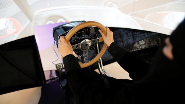Amira Abdulgader practices on a simulator car. Many young Saudis regard Mohammed bin Salman’s ascent to power as proof that their generation is finally getting a share of control over a country whose patriarchal traditions have for decades made power the province of old men. (Ahmed Jadallah / REUTERS) 