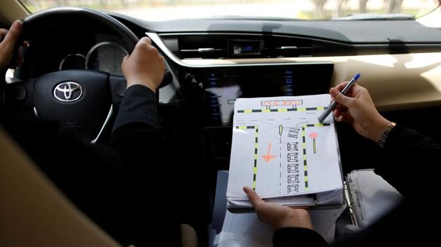 An instructor goes over road signs with Amira Abdulgader. June 24 will be for many women a celebration of a trickling cultural change, and most have special plans of how they want to celebrate this long awaited day. (Ahmed Jadallah / REUTERS) 