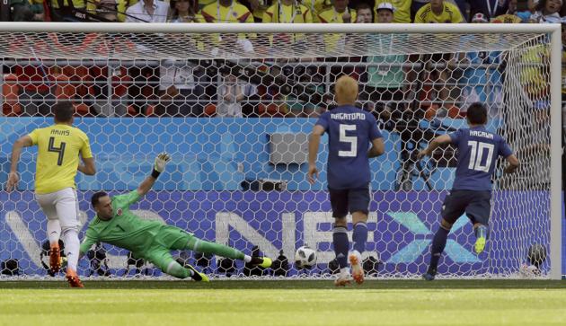 Japan's Shinji Kagawa, right, scores the opening goal by penalty during the group H match between Colombia and Japan at the 2018 soccer World Cup in the Mordavia Arena. (AP) Japan's Shinji Kagawa, right, scores the opening goal by penalty during the group H match between Colombia and Japan at the 2018 soccer World Cup in the Mordavia Arena. (AP)