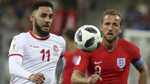Tunisia's Dylan Bronn, left, and England's Harry Kane vie for the ball during their FIFA World Cup 2018 encounter.(AP)