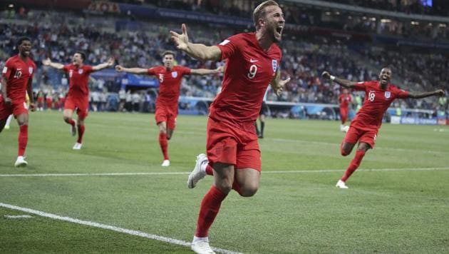England's Harry Kane (C) celebrates after scoring during the group G match between Tunisia and England at the 2018 FIFA World Cup in the Volgograd Arena in Volgograd, Russia on June 18, 2018. (AP)