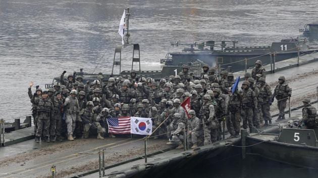 In this December 10, 2015 file photo, US and South Korean army soldiers pose on a floating bridge on the Hantan river after a river crossing operation in Yeoncheon, south of the demilitarized zone that divides the two Koreas, South Korea.(AP)