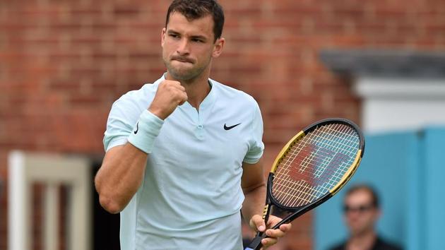 Bulgaria's Grigor Dimitrov reacts after winning a point against Bosnia and Herzegovina's Damir Dzumhur during their first round men's singles match at the ATP Queen's Club Championships.(AFP)