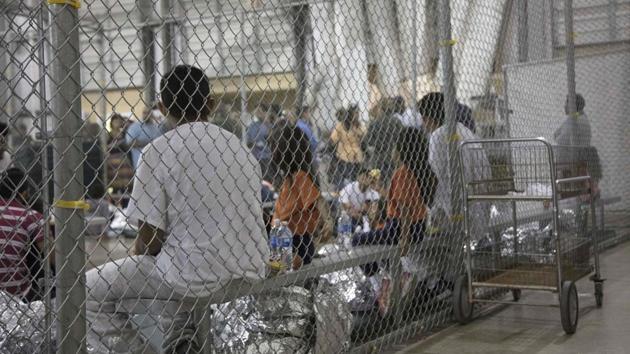 This US Customs and Border Protection photo obtained June 18, 2018 shows intake of illegal border crossers by US Border Patrol agents at the Central Processing Center in McAllen, Texas on May 23, 2018. (AFP) This US Customs and Border Protection photo obtained June 18, 2018 shows intake of illegal border crossers by US Border Patrol agents at the Central Processing Center in McAllen, Texas on May 23, 2018. (AFP)