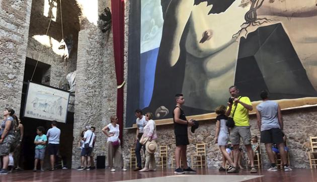 Visitors stand near the tomb of Salvador Dali inside the Dali Museum Theatre in Figueres, Spain.(AP) Visitors stand near the tomb of Salvador Dali inside the Dali Museum Theatre in Figueres, Spain.(AP)