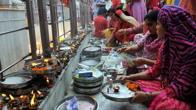 Devotees offer milk and flowers at the replica of Kheer Bhawani Temple in Jammu. (Nitin Kanotra/HT) Devotees offer milk and flowers at the replica of Kheer Bhawani Temple in Jammu. (Nitin Kanotra/HT)