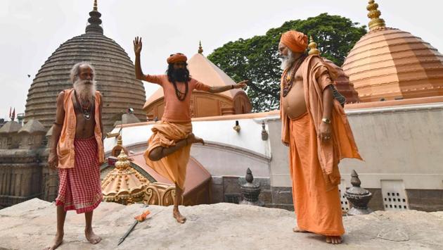 A sadhu performs yoga ahead of International Yoga Day at Kamakhya temple in Guwahati, Assam. Thousands of devotees from all over India gather on occasion of Ambubachi Mela, which celebrates the menstruation period of the goddess and during which the sanctorum of the shrine remains closed to worshippers. The Ambubachi Mela runs from June 22-25. (Biju Boro / AFP) A sadhu performs yoga ahead of International Yoga Day at Kamakhya temple in Guwahati, Assam. Thousands of devotees from all over India gather on occasion of Ambubachi Mela, which celebrates the menstruation period of the goddess and during which the sanctorum of the shrine remains closed to worshippers. The Ambubachi Mela runs from June 22-25. (Biju Boro / AFP)