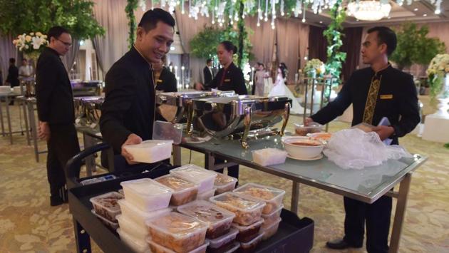 Hosts often err on the side of abundance, and many hungry revellers’ eyes are bigger than their stomachs -- meaning lots of uneaten food. Globally, about 30% of food produced every year is tossed out or spoiled -- about 1.3 billion tonnes -- which translates into some $1 trillion in economic costs, according to the UN’s Food and Agriculture Association. (Adek Berry / AFP)