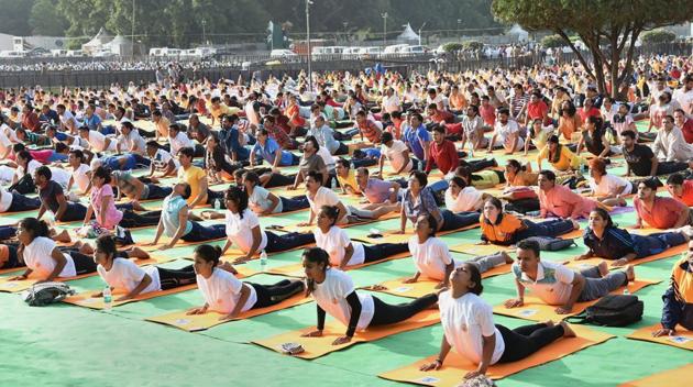 People participate in a rehearsal ahead of Prime Minister’s event on International Day of Yoga 2018, at Forest Research Institute, in Dehradun. Modi will lead at least 50,000 enthusiasts on Thursday to mark the fourth edition of the International Yoga Day in the sprawling campus of the Forest Research Institute. (PIB / PTI File) People participate in a rehearsal ahead of Prime Minister’s event on International Day of Yoga 2018, at Forest Research Institute, in Dehradun. Modi will lead at least 50,000 enthusiasts on Thursday to mark the fourth edition of the International Yoga Day in the sprawling campus of the Forest Research Institute. (PIB / PTI File)