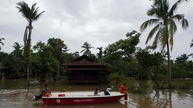 Rescue personnel from Myanmar Fire Services Deparment use a boat to assist residents. That year more than 100 people died in floodwaters that also displaced hundreds of thousands across the country. Some 138,000 people died in 2008 when Cyclone Nargis lashed vast stretches of Myanmar’s coast. (Ye Aung Thu / AFP)