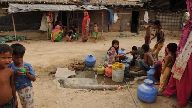 Children fill containers with drinking water at the Chandeni camp 2. Residents here contribute to pay Rs 35,000 per year as rent for the plot of land where they have made dwellings. Nisar Ahmad, a local said that the court will decide the refugees’ fate and they have no issues with them. While they lack work here, the area is safe. (Parveen Kumar / HT Photo) Children fill containers with drinking water at the Chandeni camp 2. Residents here contribute to pay Rs 35,000 per year as rent for the plot of land where they have made dwellings. Nisar Ahmad, a local said that the court will decide the refugees’ fate and they have no issues with them. While they lack work here, the area is safe. (Parveen Kumar / HT Photo)