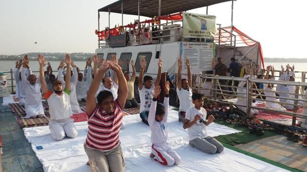 People participate in a yoga session on a cruise boat in Bhopal. (Mujeeb Faruqui / HT Photo) People participate in a yoga session on a cruise boat in Bhopal. (Mujeeb Faruqui / HT Photo)