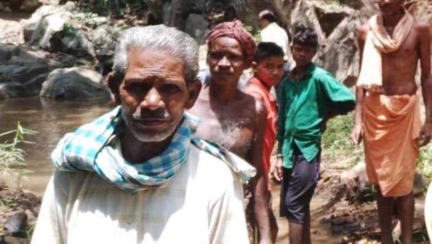 Seventy-five-year-old Daitari Nayak, who started the project on his own, was later joined by his four brothers and eventually helped by other villagers in digging the water channel through the Gonasika mountain in Odisha Keonjhar district.(HT Photo)