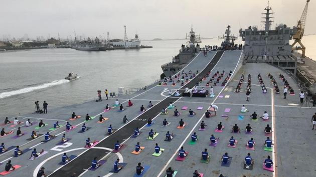 Indian Naval Cadets perform yoga on the deck of INS Virat to mark the International Yoga Day. (Bhushan Koyande / HT Photo) Indian Naval Cadets perform yoga on the deck of INS Virat to mark the International Yoga Day. (Bhushan Koyande / HT Photo)