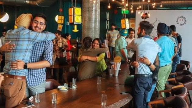 Focusing on building dialogue in public spaces and cafes, the meet-ups exhort participants to recite poems, read out from their personal diaries, and offer something as simple as a hug to the next person.(HT Photo)