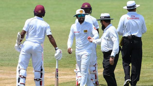 Sri Lanka captain Dinesh Chandimal (C) has been suspended for the third and final Test against West Indies after being found guilty of changing the condition of the ball in the second Test.(AFP)