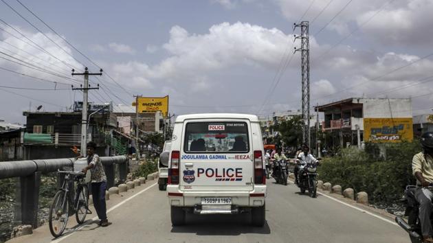 A police vehicle drives along a road in the Gadwal district. The governement has been slow to act, though the Ministry of Information and Broadcasting recently released a tender for a company to analyse social media posts and detect fake news. Rajeshwari’s efforts have prompted calls from officers in other states who hope to replicate her campaign. Still, it’s hard to ignore the messages entirely. (Dhiraj Singh / Bloomberg)