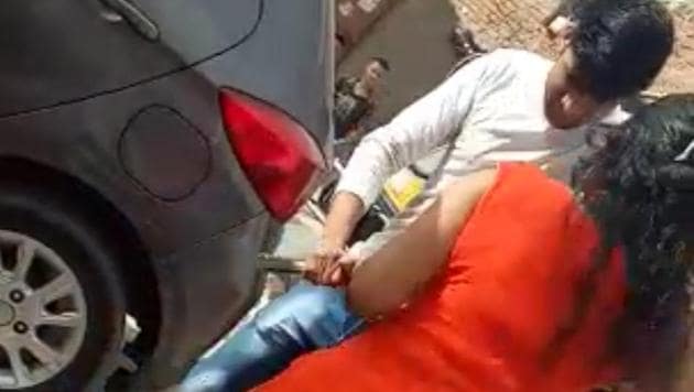 A video grab showing the accused with the country-made pistol, which she used to fire at an autorickshaw driver, on Wednesday. (HT Photo) A video grab showing the accused with the country-made pistol, which she used to fire at an autorickshaw driver, on Wednesday. (HT Photo)