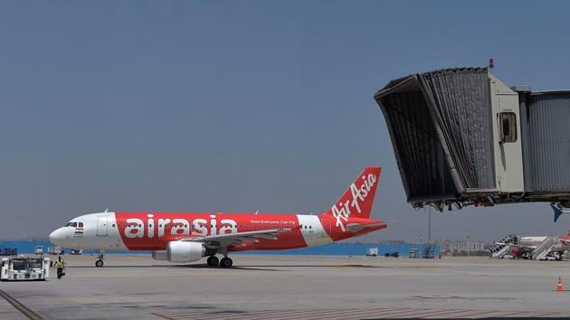 A passenger claimed that when passengers of an AirAsia India flight from Kolkata to Bagdogra refused to deboard due to heavy rain outside, the captain put the air-conditioning on full blast to hound passengers out. AirAsia India in a statement has accepted that the flight was delayed and expressed regret saying that there was no danger to anyone on-board as the cool conditioned air being circulated was condensing. (Manjunath Kiran / AFP File)