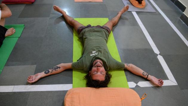 Among the Ashram’s residents is Mexican Pablo Rueda, 42, who decided to come for a week after losing his job as an aerospace engineer in Canada. “I was depressed and wondering what to do with my life,” he said, fresh from a communal breakfast where guests sit on the floor and eat in silence from individual small tables. “I wanted to practise yoga, which I love, and meditate.” (Sajjad Hussain / AFP)