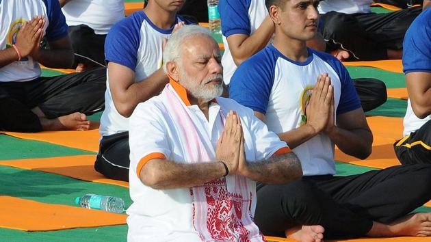 Prime Minister Narendra Modi performs yoga on International Yoga Day in Dehradun.(REUTERS)