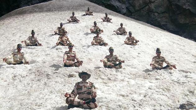 ITBP personnel perform yoga to commemorate International Day of Yoga, at the Himalayas near Ladakh region. (ITBP / PTI) ITBP personnel perform yoga to commemorate International Day of Yoga, at the Himalayas near Ladakh region. (ITBP / PTI)
