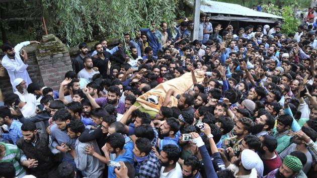 Kashmiris carry the body of Hizbul Mujahideen commander Burhan Wani during his funeral procession in Tral on July 9, 2016. The killing of Wani, considered a hero among locals, sparked months of unrest in the Valley, pitting civilians against security forces and leading to scores of deaths and dozens more injured.(Waseem Andrabi/ HT File Photo) Kashmiris carry the body of Hizbul Mujahideen commander Burhan Wani during his funeral procession in Tral on July 9, 2016. The killing of Wani, considered a hero among locals, sparked months of unrest in the Valley, pitting civilians against security forces and leading to scores of deaths and dozens more injured.(Waseem Andrabi/ HT File Photo)