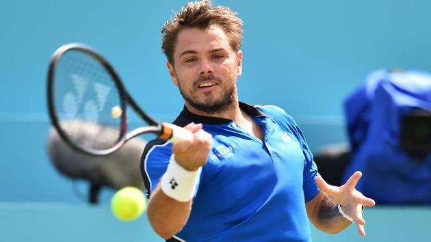 Stan Wawrinka returns to Sam Querrey during their match at the Queen's Club tennis tournament on Wednesday.(AFP)