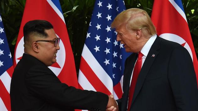 North Korea's leader Kim Jong Un (L) shakes hands with US President Donald Trump (R) after taking part in a signing ceremony at the end of their historic US-North Korea summit, at the Capella Hotel on Sentosa island in Singapore on June 12, 2018. (AFP) North Korea's leader Kim Jong Un (L) shakes hands with US President Donald Trump (R) after taking part in a signing ceremony at the end of their historic US-North Korea summit, at the Capella Hotel on Sentosa island in Singapore on June 12, 2018. (AFP)