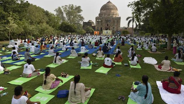 People gather to perform yoga in the quest for good health and well-being at Lodhi Gardens. As UN Deputy Secretary-General has said, Yoga is “very apt” for the UN and in today’s complex world where stress and delusion are prevalent, the ancient Indian physical and mental practice plays a central role for wellness and peace of the mind and body. (Sanchit Khanna / HT PHOTO) People gather to perform yoga in the quest for good health and well-being at Lodhi Gardens. As UN Deputy Secretary-General has said, Yoga is “very apt” for the UN and in today’s complex world where stress and delusion are prevalent, the ancient Indian physical and mental practice plays a central role for wellness and peace of the mind and body. (Sanchit Khanna / HT PHOTO)
