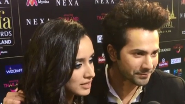 Varun Dhawan and Shraddha Kapoor arrive at the IIFA Awards 2018 green carpet.