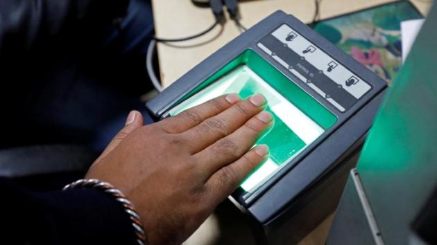 A woman goes through the process of finger scanning for the Unique Identification (UID) database system, also known as Aadhaar, at a registration centre in New Delhi, India, January 17, 2018.(Reuters File Photo)