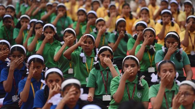 Students of Abhinav English Medium School, Ambegaon, perform a breathing exercise during the yoga session organised on the occasion of International Day of Yoga. Puneites from all walks of life were part of the celebrations as various institutions and organisations practised yoga for a healthier life. (Pratham Gokhale/HT Photo) Students of Abhinav English Medium School, Ambegaon, perform a breathing exercise during the yoga session organised on the occasion of International Day of Yoga. Puneites from all walks of life were part of the celebrations as various institutions and organisations practised yoga for a healthier life. (Pratham Gokhale/HT Photo)