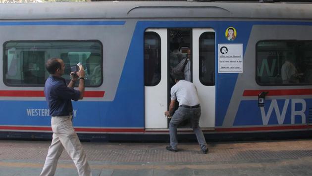 On Friday morning, passengers complained of suffocation inside Mumbai’s suburban AC local train after the air-conditioning stopped working. The temperature inside the compartments reportedly shot up to 36 degrees Celsius, forcing commuters to pull the chain after which the train was halted at Andheri station. This is the second Friday in a row that there has been a problem with the AC train. (Bhushan Koyande / HT File)