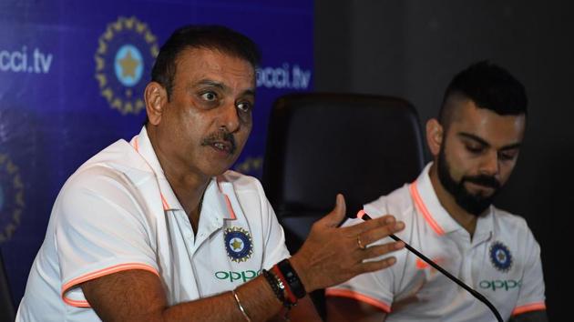 Indian cricket team head coach Ravi Shastri (L) speaks as captain Virat Kohli looks on during a press conference in New Delhi.(AFP)