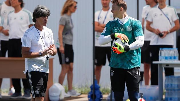 Germany's coach Joachim Loew (L) and goalkeeper Manuel Neuer (R) take part in a training session at the Olympic Park Arena in Sochi ahead of their FIFA World Cup 2018 match against Sweden.(AFP)