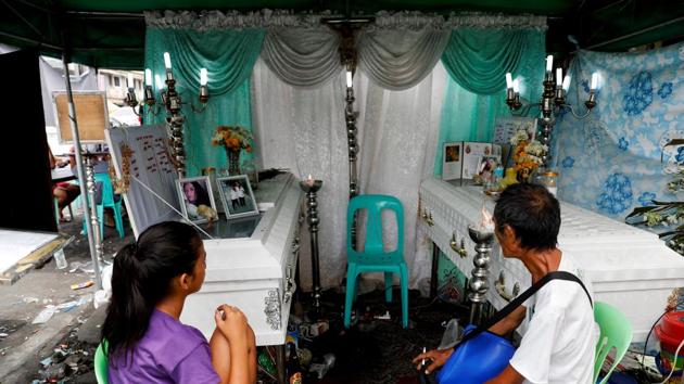 Marybeth Antier, 24, (not pictured) recalled with horror a recent fire that killed six members of her family. At their funeral, their bodies were squeezed into the two caskets she could afford. “I saw the building where we live already ablaze,” she said. “My child was inside but I could not enter anymore.” (Erik De Castro / REUTERS) Marybeth Antier, 24, (not pictured) recalled with horror a recent fire that killed six members of her family. At their funeral, their bodies were squeezed into the two caskets she could afford. “I saw the building where we live already ablaze,” she said. “My child was inside but I could not enter anymore.” (Erik De Castro / REUTERS)