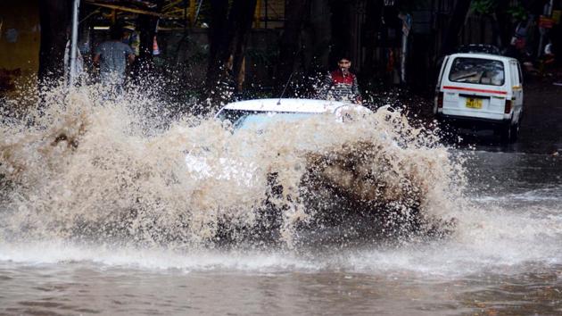 NATURE’S FURY: A car tries to cut through a water logged area at Rakshaknagar, Kharadi, on Thursday. The city was drowned in a sea of muck after only a few hours of heavy downpour. (Shankar Narayan/HT PHOTO) NATURE’S FURY: A car tries to cut through a water logged area at Rakshaknagar, Kharadi, on Thursday. The city was drowned in a sea of muck after only a few hours of heavy downpour. (Shankar Narayan/HT PHOTO)