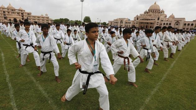Students participate in an attempt to create the world record of the most people performing KATA at the same time in Ahmadabad, Gujarat, to mark World Karate Day on June 17, 2018. (Ajit Solanki / AP) Students participate in an attempt to create the world record of the most people performing KATA at the same time in Ahmadabad, Gujarat, to mark World Karate Day on June 17, 2018. (Ajit Solanki / AP)