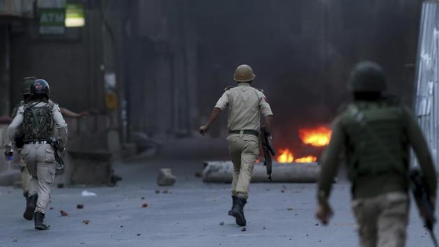 A policeman and four militants were killed in a shootout at Nowshera village in South Kashmir on Friday, police said. A civilian and a policeman were also killed in clashes between police and local residents that erupted in the neighbourhood. Islamic Stata J&K chief Dawood Salafi alias Burhan from HMT Srinagar, has been identified among those killed. (Dar Yasin / AP File)